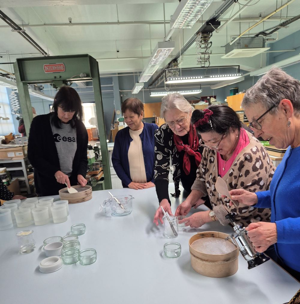 C4W_Conservation for Wellbeing participants learning to make paste.jpg 1