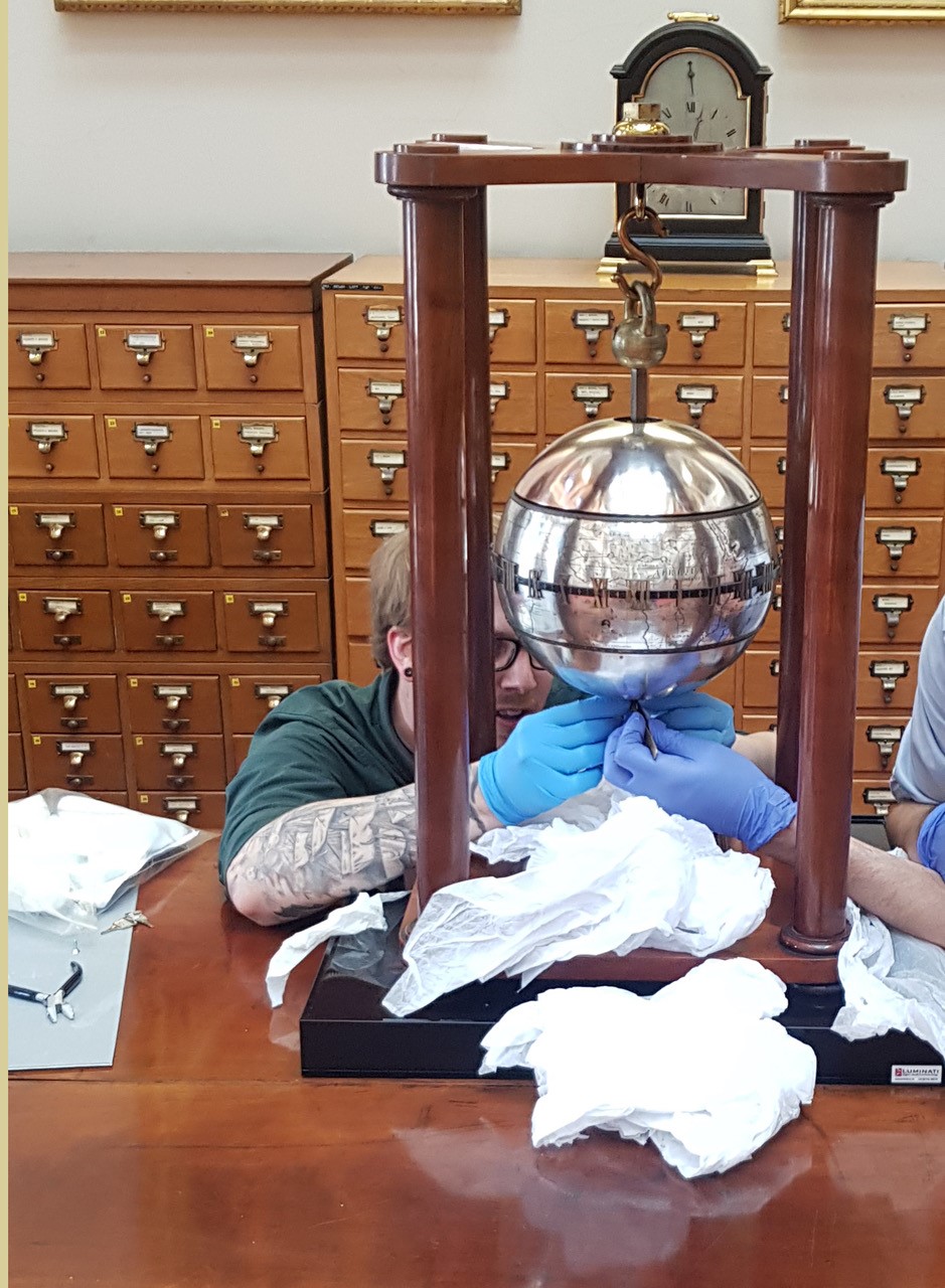 Dale S Reinstalling the Society of Antiquaries' Falling Globe Clock .jpg